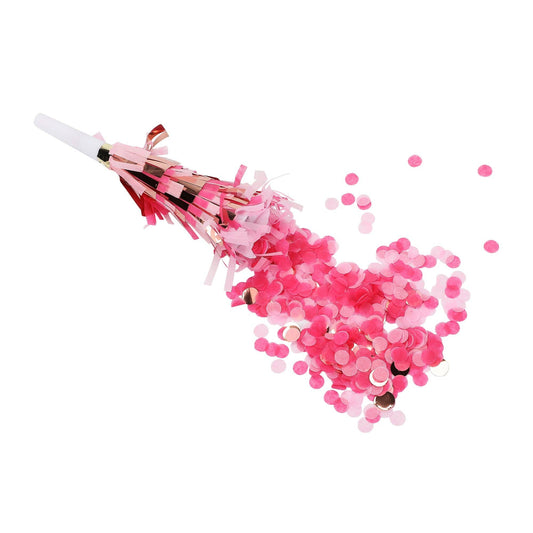 Pink confetti cannon with pink confetti on a white background