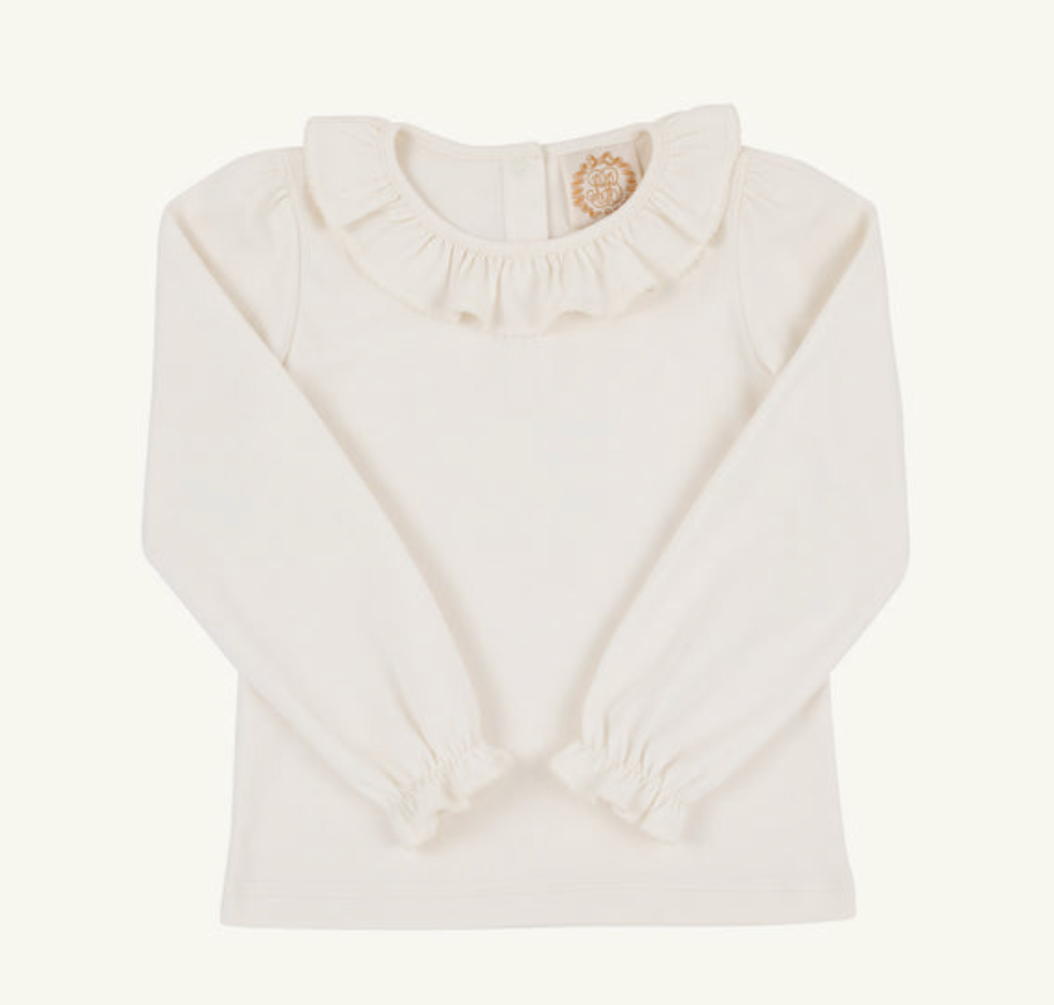 An off-white long-sleeve baby top with a ruffled Peter Pan collar and a small gold embroidered circular detail at the back of the collar, shown on a plain off-white background.