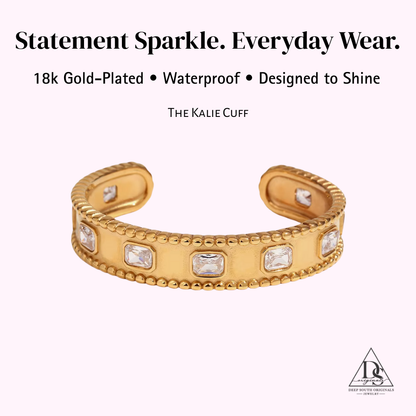 Gold-plated cuff bracelet with embedded stones on a white background, featuring text about its features.