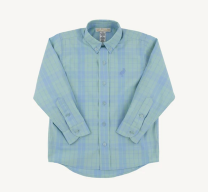 A light blue and green plaid long-sleeve button-down shirt with a small embroidered polo player logo on the left chest, displayed flat against a light cream background.
