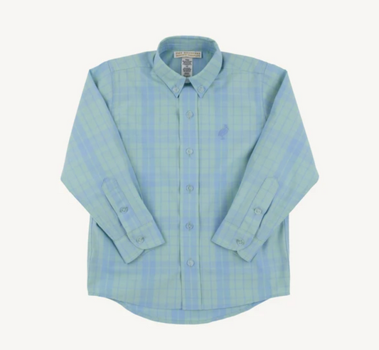 A light blue and green plaid long-sleeve button-down shirt with a small embroidered polo player logo on the left chest, displayed flat against a light cream background.