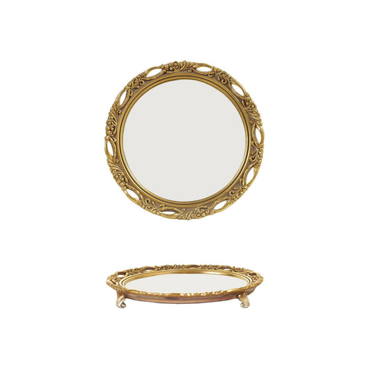 An ornate oval tabletop mirror platter with a decorative gold frame, shown in two views: one standing upright and one lying flat on its side, against a plain white background.