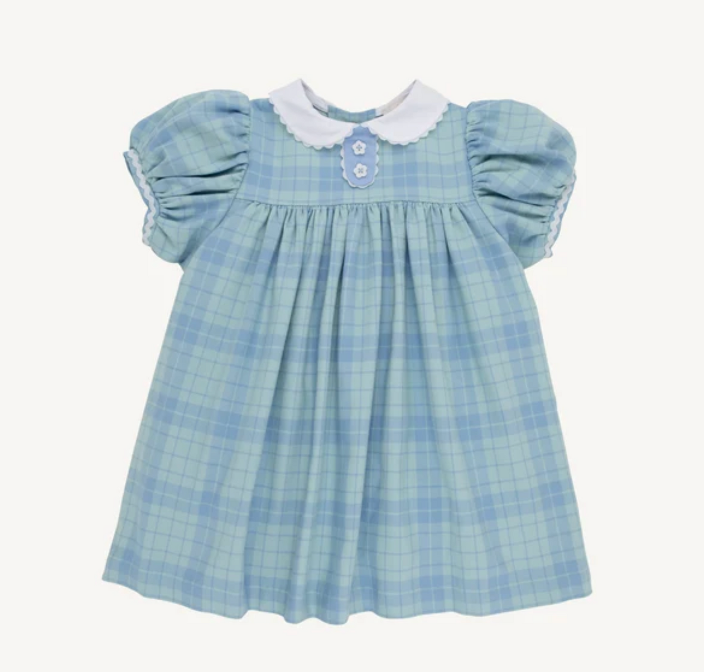 A baby girl's light blue and white plaid dress with short puff sleeves, a white ruffled Peter Pan collar, and a buttoned yoke detail.